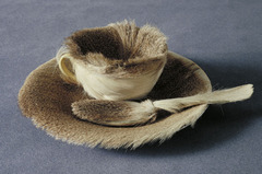 138. Object (Le Dejeuner en fourrure)
Location: ?
Artist: Meret Oppenheim
Date: 1936 C.E.
Culture: ...
Period/Style: Later Europe/America
Medium/Material: Fur, cup, saucer, spoon
Theme(s): femininity
Form: ...
Function: ...
Content: cup, saucer, and spoon covered in fur
Context:The work, which originated in a conversation in a Paris cafe, is the most frequently-cited example of sculpture in the surrealist movement. It is also noteworthy as a work with challenging themes of femininity.
Cross Cultural Connection(s):