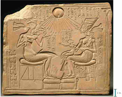 22. Akhenaton, Nefertiti, and three daughters
Location: New Kingdom, 18th Dynasty
Artist: N/A 
Date: c. 1353-1335 B.C.E. 
Culture: Egyptian
Period/Style: Ancient Egyptian
Medium/Material: Limestone
Theme(s): religion
Form: Shape, line, and value used to form the figures and their surroundings.
Function: Depict Akhenaten and his wife and their relation to the new god, Aten
Content: Lines at the top point either to Akhenaten and his wife or to the circular shape in the top middle
Context: A piece that would be in someone's home home, not in a public place, depicting relation between the ruler and the god