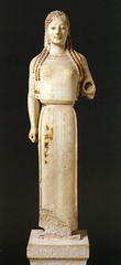 28. Peplos Kore from the Acropolis. Archaic Greek. c. 530 B.C.E. Marble, painted details.
-Athens, Greece
-woman (possibly Athena because of adorned dress, headdress, and bow)
-function: honoring Athena (either an offering or a depiction)
-raised left arm and archaic smile (shows well-being, not emotion) representative of archaic style
-brightly painted with animal figures on clothing to represent fertility and prosperity
-kore (young women) statues were offerings to goddesses
-closely tied to Greek gods/religion