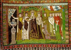 51c. Theodora and Attendants
Location: San Vitale; Ravenna, Italy
Date: c. 547 C.E.
Period/Style: Early Byzantine
Medium/Material: mosaic
Theme(s): authority and unity between state and church, similarly to Justinian and Attendants
Form: displacement of absolute symmetry with Theodora (play a secondary role to her husband)
Function: depicts Theodora and her attendants participating in the Mass
Content: Richly robed empress and ladies at court, stands in an architectural framework, holding a chalice for the mass, and is about to go behind the curtain, flattened and weightless
Context: Three Magi, who bring gifts to the baby Jesus, are depicted in the hem of her dress, referring to a parallel between Theodora and the Magi
Cross Cultural Connection(s): Dome of the Rock interior
