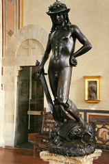 69. David
Location: Florence, Italy 
Artist: Donatello
Date: c. 1440-1460 C.E.
Period/Style: Early Italian Renaissance
Medium/Material: Bronze
Theme(s): humility and victory
Form: exaggerated contrapposto, life-size, androgynous, nonchalance
Function: ...
Content: head lowered to suggest humility; Laurel on hat indicates David was a poet (hat is a foppish Renaissance design)
Context: first large bronze nude since antiquity
Cross Cultural Connection(s): Seated Boxer