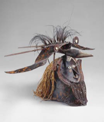 Buk (mask)
mid to late 19th century CE
turtle shell, wood, fiber, feathers, shell
Torres Strait
#218

-part of an elaborate costume that would be worn by a dancer and seen at rituals for the harvest, funerary rituals, etc.
-could represent a hero, ancestor, or the bird on the top of the mask could be associated somehow with the human face
-strong connection between man and supernatural
