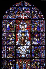 Chartres Cathedral Notre Dame de la Belle Verriere Window

Mary crowned as Queen of Heaven with Christ child on her lap
Light as a manifestation of the divine, shades color patterns across the grey stone of the cathedral 
Part of a lancet window 
Undamaged by the fire of 1194, reset with framing angles on either side of the main scene after reconstruction
Bar tracery as bars go across the window to provide support