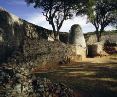 Concial tower and circular wall of Great Zimbabwe

South Zimbabwe, Shona Peoples, 1000-1400, Granite blocks

Zimbabwe derives from Shona term meaning venerated house or house of stone
Prosperous trading center and royal complex
Stone enclosure, probly royal residence
Walls 800ft long, 32 ft tall, 17 ft thick at the base
Conical tower modeled on traditional shapes of grain silos, control over food symbolized wealth/power
Wall slope inwards at the top
Passageways very narrow/long so single file line necessary
Tower resembles granery representing good harvest