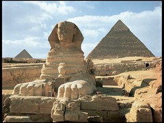 Great Pyramids (Menkaura, Khafre, Khufu) and Great Sphinx
Giza, Egypt. Old Kingdom, Fourth Dynasty. c. 2550-2490 B.C.E. Cut limestone.
1. The three great pyramids were grave sites for three rulers (Khufu, Menkaure, Kharfe) with mortuary temples attached for offerings to the deceased pharaohs. The pyramid was considered a place of regeneration for the ruler. 
 2. The pyramids are guarded by a great sphinx which has a heard of a human and body of a lion. It is carved in situ from a huge rock to symbolize the sun god. Cats are also royal animals in Egypt which is why it is in front of royalty. 
 3. They were made of limestone and all the pyramids tips (ben-bens) were solar reference to the sun god. The sun rays were a ramp to climb to the sky. 

4. Khufu's pyramid was the largest and he had a ton of boats in his tomb so he could transport to places. Kharfe's pyramid was the middle size and the great sphinx was directly outside of it. Menkaure's pyramid is the smallest of the three and the sculpture of King Menkaure and his queen is found inside.