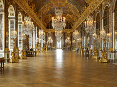 Hall of Mirrors

240 feet long barrel vaulted room with a painted ceiling
Light enters thorugh a wall of windows on one side and reflects of a wall full of mirrors on the other side, these were the largest panes of the glass that could be made at the time
Reflected light would illuminate the entire room so Louis could see everything that was taking place
Celing paintings illustrate civil and military achievements of Louis XIV
Other paintings throughout the palace illustrate that his rule would bring peace/harmony to France
Most rooms/salons dedicated to Louis's intellectual and leisure interests