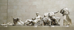 Helios, Horses, and Dionysus on the Acropolis 

Sculpture on east Pediment of the Parthenon, classical period 
Central portion which no longer survives depicts the birth of Athena from the head of Zeus
Figures are relaxed yet sense of nobility and god status present 
Sculpture have classical depiction with flowing drapery revealing the from of their bodies
Figures heighten as they get towards the middle because in triangular space