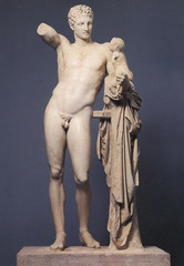 Hermes and the Infant Dionysos
c. 340 BCE; 
Period: Classical Greek
Artist: Praxiteles
Roman copy of bronze original. Shallow S-shaped curve, Dionysus reaching for grapes that were once held by Hermes.
