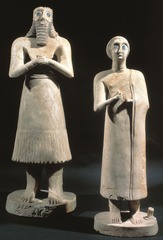ID: Statues of votive figures. Ancient Mediterranean. Square temple at Eshnunna(modern Tell Asmar, Iraq). Sumerian 27000 BCE. Gypsum inlaid with shell and black limestone. 
Form: limestone, alabaster, gypsum 30
