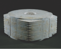 Jade Cong

China, 3300-2200 B.C.E.
Carved Jade

Circular hole inside a square
Abstract geometric design with 4 corners having mask-like images representing spirits/deities
Jade found in tombs of elite and linked with virtues of durability, solidity, and beauty
Neolithic Liangzhu China