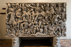 Ludovisi Battle Sarcophagus 
Late Imperial Roman. c. 250 C.E. Marble
1. The romans are the good guys and the bad guys are the goths, the romans are portrayed as noble, stern, and serious which is to show importance of battle, heroic, and idealized while their enemies look barbaric, ugly, concerned, and in fear. 

 2. There is no room to move with dense carpet of figures, there is 2 to 3 layers of figures. As your eyes move down the figures get smaller so that we have a different perspective called organizing perspective. 

 3. In the center is the obvious hero on his horse opening up his arms. He is calm and composed like a good leader. He doesn't have a helmet which shows he is invincible, all powerful, and needs no protection. Light and dark variations animate the surface. 

4.Someone wealthy and powerful owned the sarcophagus because it took a very long time to carve with a very skilled carver. The surface mirrors the chaos of the empire at the time after Augustus which was very unstable so the surface shows chaos which can be linked to the instability of the empire. Turning away from Greek high classical art and becomes less concerned with individuality and the elegance of the human body.