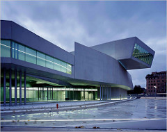 MAXXI National Museum of XXI Century Arts
Rome, Italy. Zaha Hadid (architect). 2009 C.E. Glass, steel, and cement.
 The building is repetitive in that the architecture is supposed to mimic movement to depict the progressiveness of the future of architecture and building.