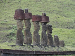 Moai on platform 
Easter Island 1100-1600, Volcanic tuff figures on basalt base.

Statues of tribal chiefs on the island, meant to mediate b/w chiefs and gods
 About 900 statues, mostly male, all facing inland, 50 tons/statue
Erected on large platforms of stone mixed with ashes from cremations; the platforms are as sacred as the statues on them
Images represent personalities deified after death
prominent foreheads, large broad noes, thin pouting lips, ears that reach to the top of their heads
short thin arms falling straight down; hands across lower abdomen below navel
chests and navels delineated
topknots added to some statues
white coral placed in eyes to 