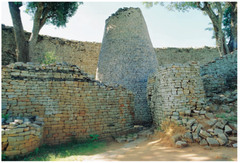 Name: Conical Tower and Circular Wall of Great Zimbabwe

Date: 1000 CE

Medium: Coursed granite blocks

Location: Southeastern Zimbabwe

Artist: Shona Peoples

Form: Great enclosure with multiple areas, brick huts, smooth walls - no mortar was used,

Function: Religious center, wall to keep in cattle, palatial complex

Content: Great wall and large tower (tower is religious center), chevron pattern near top

Context: In between gold rich plateau and Indian Ocean ports