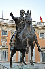 Name: Equestrian Statue of Marcus Aurelius

Date: 175 CE (Empire)

Medium: Bronze

Location: Italy

Artist: Unknown

Form: Un proportional - the emperor is much larger than the horse

Function: To showcase the power of the Emperor

Content: Emperor has majesty and authority, his right arm is in an authoritative gesture, right 

Context: He's divine because he's emperor