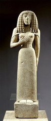 Name: Lady of Auxerre

Date: 650 BCE (Archaic) 

Medium: Marble

Location: Greece

Artist: Unknown

Form: Daedalic Style - mainly decorative, realism

Function: Decoration

Content: Broad head, hair is in layered wigs, clothes do not have folds, geometric/oriental patterns, used to be painted, hand on chest is not proportional because hands are hard to create

Context: N/A