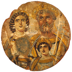 Name: Painted Portrait of Septimius Severus and His Family
 
Date: 200 CE (Empire)

Medium: Tempera on wood

Location: Roman Empire

Artist: Unknown

Form: Painted family portrait

Function: To have a family portrait??

Content: Septimius Severus and his family, Septimius has long, grey hair and a beard, Greta's face is scratched out

Context: Septimius Severus was an African general, he left the empire to Greta, his other son Caracalla got mad and had Greta killed and scratched his face out of every family portrait