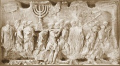 Name: The Spoils of Jerusalem

Date: 81 BCE (Empire)

Medium: Stone

Location: Rome, Italy

Artist: Unknown

Form: Narrative, high relief panels

Function: To showcase Titus' power and victories

Content: Roman soldiers carrying spoils (a menorah) from the Temple of Jerusalem

Context: Titus took over Jerusalem