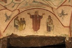 Orant Figure:
Fresco above a tomb niche on an arched wall
Stands with arms out in prayer, figure is dark and compact against the light background 
Left shows teacher with children
Right shows mother and child referring to Mary and Jesus