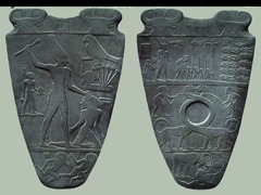 Palette of King Narmer 
Pre-dynastic Egypt. c. 3000-2920 B.C.E Greywacke
1. The palette depicts King Narmer as he is uniting Upper and Lower Egypt. His name appears on both sides of the palette and is so valuable that it has never been permitted to leave the country (2-3)

2. On the front of the palette, Narmer is shown wearing the crown of Lower Egypt (red crown) and looking at the dead bodies of his enemies. In the center there are lions with elongated necks which symbolize unification (would have held the makeup). At the bottom of the front side there is a bull knocking down a fortress. This symbolizes Narmer killing his enemies. (2-3B)

3. On the back of the palette is Narmer wearing bowling-pin shaped crown of Upper Egypt (white crown). The king's protector, Horus, is also pictured holding a rope and a papyrus plant around a man's head. These are symbols of Lower Egypt. (2-2A)

4. The palette was used to prepare eye makeup which was used to protects their eyes from the sun. It was probably commemorative or ceremonial. (2-2)

1. This palette is divided into registers, to divide the subject into different scenes and show the importance of certain components of the scene. The pharaoh is shown much larger than all other figures, and represented in composite view. This method of portraying bodies was meant to give the viewer the most information possible about the subject, and was also based in the idea that you had to represent all parts of a figure for the person to be complete in the next world. (2-2.a, 2-3)
2. The pharaoh is much larger than all other figures and is also shown in an idealized form with broad shoulders, small hips and waist, and a muscular form. His enemies are shown trampled under his feet or beheaded. On the top of this piece there is a cartouche, or a place to put the pharaoh's god name after his death. (2-3.b) 
3. This piece was made to celebrate the success of the pharaoh in uniting upper and lower Egypt into one kingdom. Cats with long necks that bend like serpents represent the union of Egypt as one of the animals wears the crown of upper Egypt and the other one of lower Egypt. The pharaoh wears a crown combining the two styles. (2-1)
4. The goddess mother of the pharaohs is present to show the divinity of the pharaoh. The god Horus- ruler of the earth, is also present to demonstrate that order on earth, or ma'at, is brought by the pharaoh's divinity and his connection to Horus. (2-2)