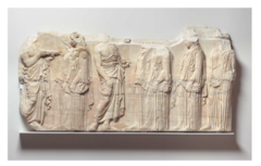 Plaque of the Ergastines from Acropolis

Depicts the Pan-Athenian procession where citizens of Athens came together and walked along the sacred way up to the Acropolis where the Parthenon stood
Shows contemporary real life event not common to temple sculpture
Figures appear noble and depicted naturally as it was the high classical period, 
Intricate folds follow the form of the peoples bodies, other areas drapery falls straight down
Contrapposto pose showing dynamism of figures as they walk
6 Ergastines shown who were responsible for making the peplos that would be put on a sculpture of Athena during the festival