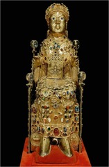 Reliquary of Saint Foy

9th century C.E., gold silver, gemstones, enamel over wood

Reliquary of a young girl martyred in the early fourth century; she refused to sacrificeto the Roman gods in a pagan ritual
Relics of her body stolen fora nearby town and enthroned in the Conques in 866
One of the earliest large scale sculpture in the Middle Ages
Jewels, gems, crown added over the years by the faithful
Childs skull is housed in the rather masculine looking enlarged head