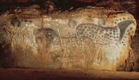 Spotted horses and negative hand imprints, wall painting in the cave at Pech-Merle, France