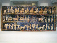 Standard of Ur from the Royal Tombs at Ur (modern Tell el-Muqayyar, Iraq). Sumerian. c. 2600-2400 B.C.E. Wood inlaid with shell, lapis lazuli, and red limestone.