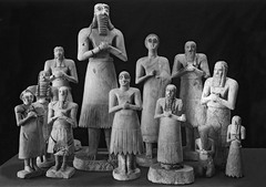 Statues o votive figures, from the Square Temple at Eshnunna. Sumerian. c. 2700 bce. Gypsum inlaid with shell and black limestone