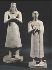 Statues of votive figures, from the Square Temple at Eshnunna (modern Tell Asmar, Iraq). Sumerian. c. 2700 B.C.E. Gypsum inlaid with shell and black limestone.