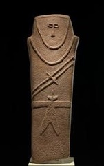Title: Anthropomorphic Stele
Period/ Style: Neolithic New Stone Age 
Date: 4000 BCE
Original Location: Arabian Peninsula
Material: Sandstone 
Technique/Style/Description: carved sandstone in the shape of a human with a sword
Historical Context: Probably a grave marker for protection. 
Message/Meaning: 
anthropomorphic: human shape, human like characteristics, appears to be wearing human clothes
stele: vertical slab usually of stone used to mark or proclaim something