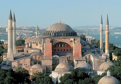 *Title:* Hagia Sophia

*Artist:* Anthemius of Tralles and Isidorus of Miletus

*Period/Style:* Byzantine

*Date:* 530 CE

*Patron:* Justinian I

*Original Location:* Constantinople; modern day Istanbul, Turkey

*Material:* marbles from all over empire

*Subject:* Church, later converted into Mosque, and now a museum

*Technique and Description:*
-central and axial plan
-dome (bottom has 40 windows)
-arches
-half domes
-minarets added
-pendentive
-hidden piers

*Context:*
-Justinian ended a riot in one of his cities, burned citizens, needs to assert power
-Pagan temple --> Christian basilica --> Hagia Sophia
-largest church in the entire world
-down the street from Justinian's palace
-1400's Ottoman Empire takes over, converted to Muslim mosque (cover mosaics w/ silks, add medallions, added minarets)

*Message/Meaning:*
-windows in dome make it look like it is suspended from heaven
-when emperor and archbishop came together, symbolized heavenly and earthly power
-mosaic 
-features mosaic with Christ as Pantocrator --> cannot look him in the eyes b/c he is so powerful