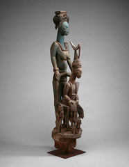 Veranda post: equestrian figure and female caryatid. Olowe of Ise (Yoruba peoples). Before 1938 C.E. Wood and pigment.