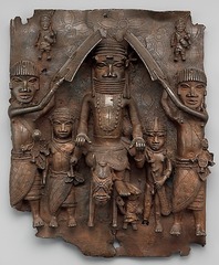 Wall plaque of Oba Palace

Edo Peoples, Benin (Nigeria), 16th century, cast brass

900 brass plaques similar to this one, 16-18 inches
Decorated walls of the royal palace of Benin
Part of palace complex where these plaques would be placed on top of wooden pillars
Demonstrate the court life in Benin culture. 
Oba 