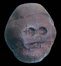 Waterworn pebble resembling a human face, from Makapansgat, South Africa